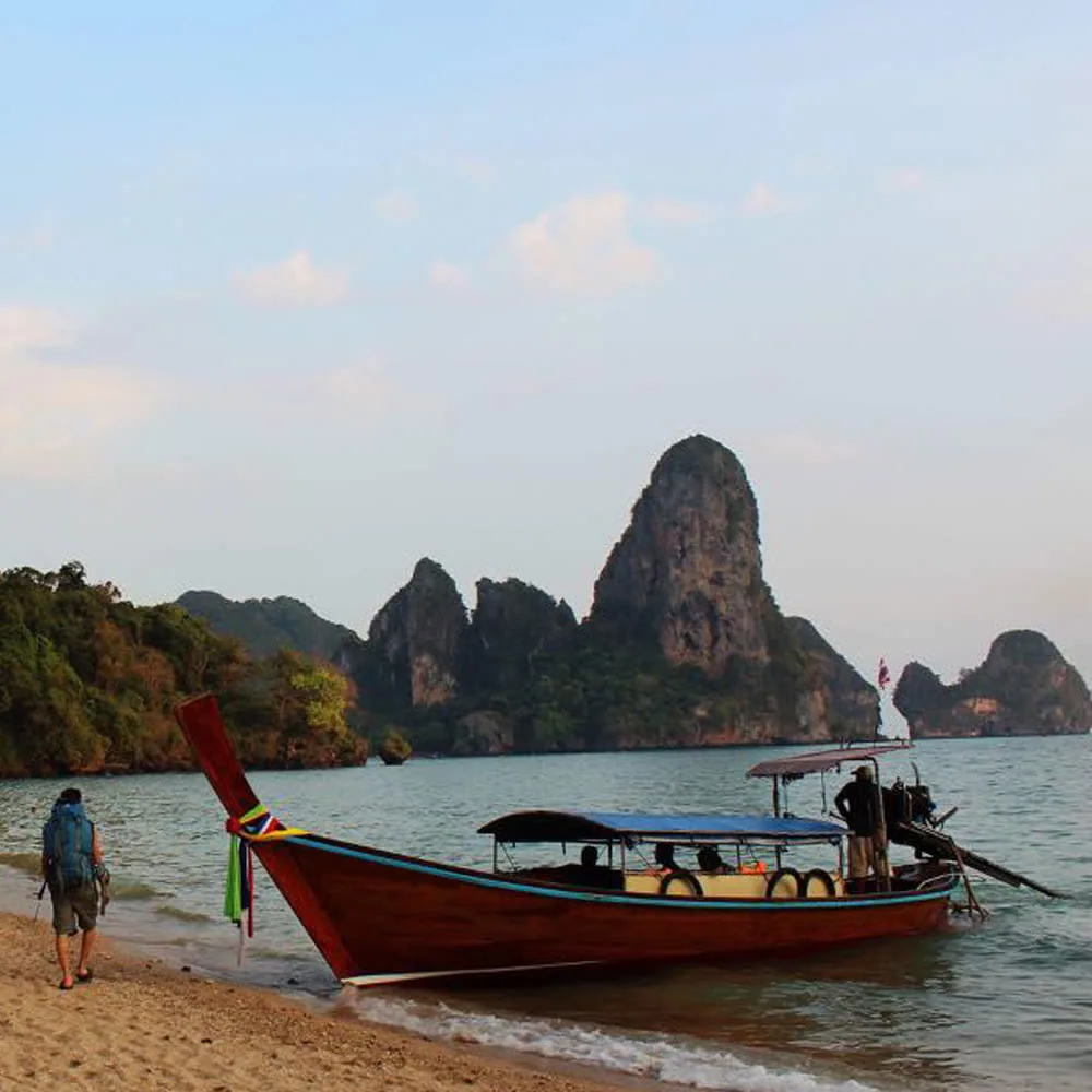 Limestone cliffs rise above the coast near Tonsai and Railay climbing areas.